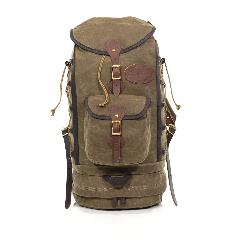 Handmade large daypack made with waxed canvas premium leather and high quality brass buckles and rivets.