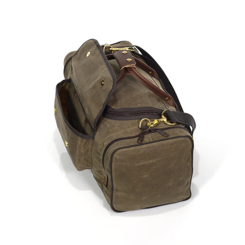 Handmade luggage bag with exterior pockets.