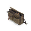 On the front of the bag are two waxed canvas pouches and a heavy duty zippered sleeve pocket.