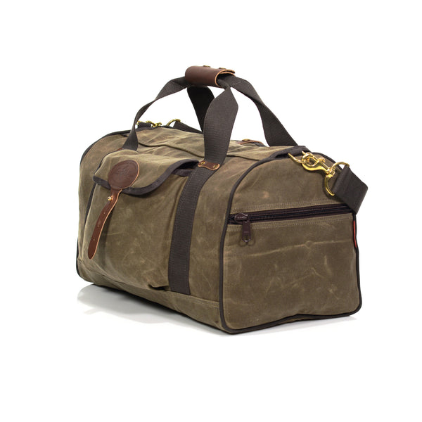 Frost River duffel bag with zippered pockets on each end of the bag for additonal storage and a strong shoulder strap with solid brass attachment points to each end of the bag.