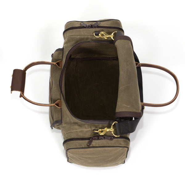 Waxed canvas duffle bag, featuring an east access zippered opening.