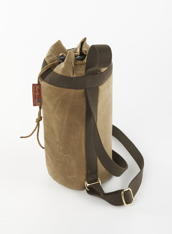 Handcrafted with durable waxed canvas, strong webbed cotton, and solid brass.