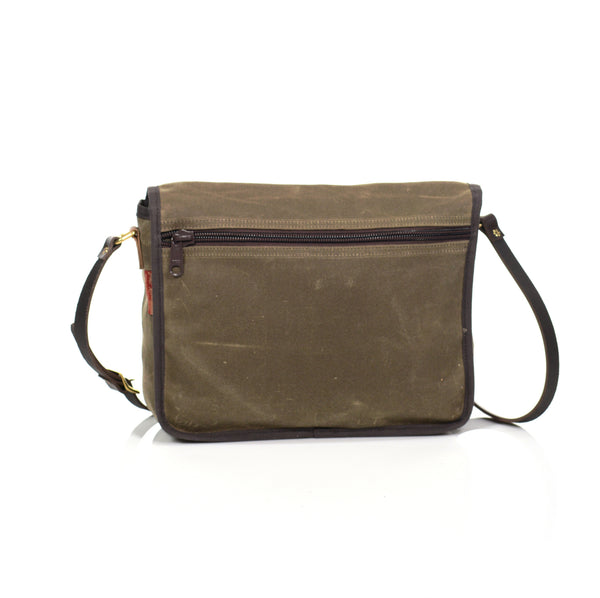 The backside of the satchel has a heavy duty nylon coiled zipper sleeve for additional storage.