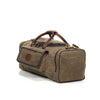 Waxed canvas duffle bag with premium leather grab handles.