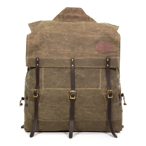 Large canoe pack made with durable waxed canvas, premium leather, and solid brass.