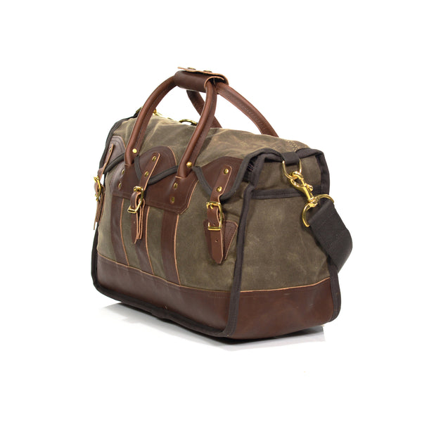 Durable luggage bag, with premium leather straps and solid brass buckles. 