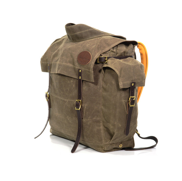 Handcrafted with durable waxed canvas, premium leather, and solid brass.