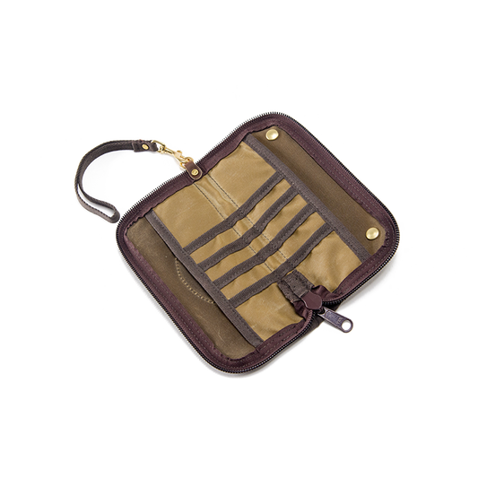 The interior having several small pockets down the middle and two slip sleeves on either side. 