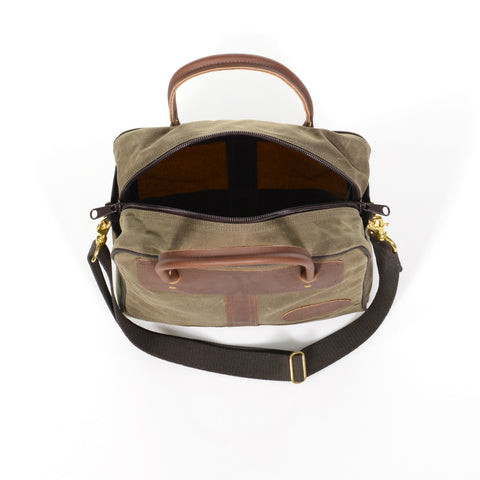 Large main compartment with a double coil zippered closure.
