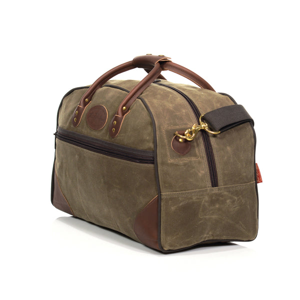 Handcrafted waxed canvas luggage bag, featuring removable a cotton webbed shoulder strap.