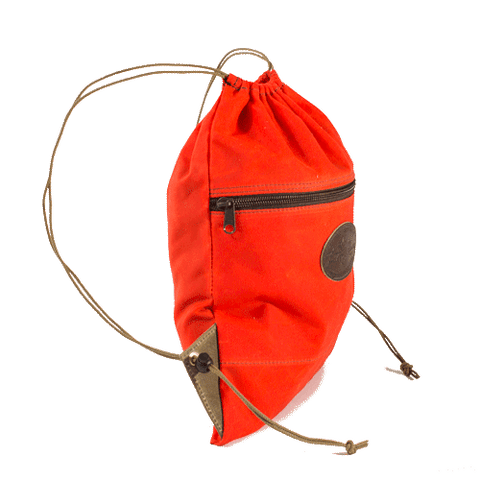 Side view of the hunter orange day pack handmade with durable water resistant waxed canvas.