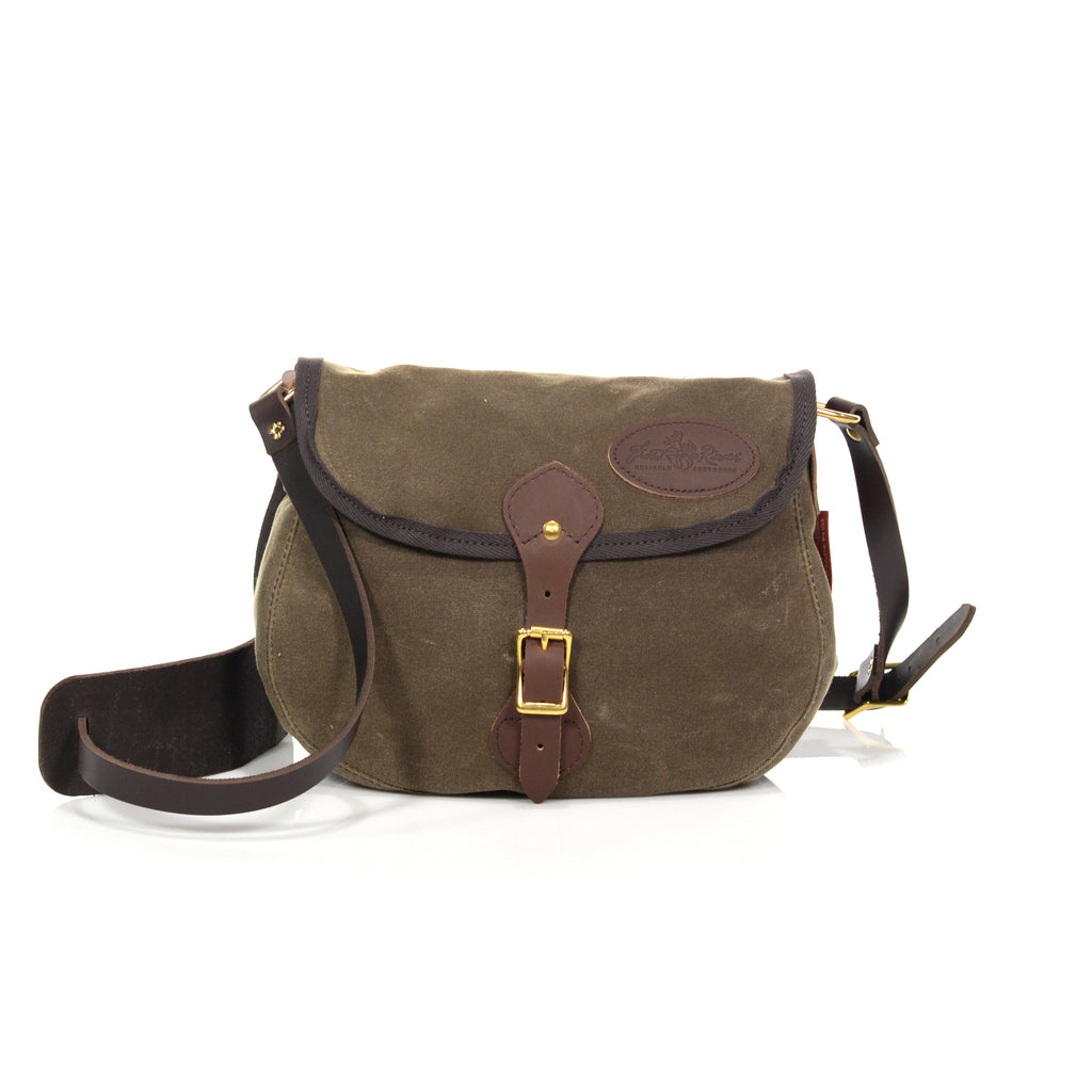 Traditional shoulder bag made with premium leather, solid brass, and durable waxed canvas.