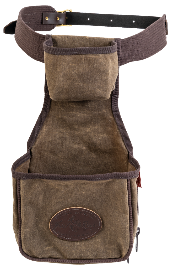 The Skeet Pouch includes a waist belt and is made from durable waxed canvas, premium leather, and solid brass.