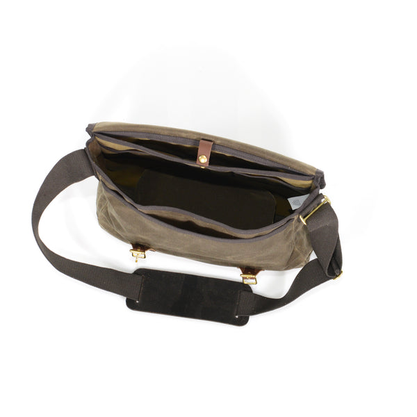 The interior of the Premium Carrier Brief Messenger Bag also contains an extra slip sleeve pocket secured with a solid brass snap.