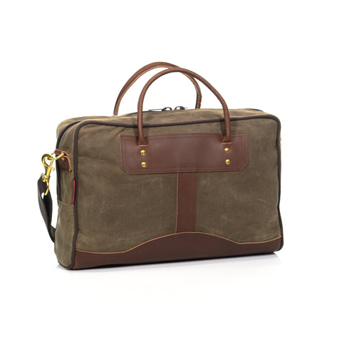 High end waxed canvas and premium leathers makes this brief stylish and sturdy. A webbed cotton shoulder strap reinforced by two solid brass attachment points, makes this bag easy to travel with.
