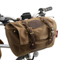 The Caribou Trail Bike bag is made from premium leather, durable waxed canvas, and solid brass.