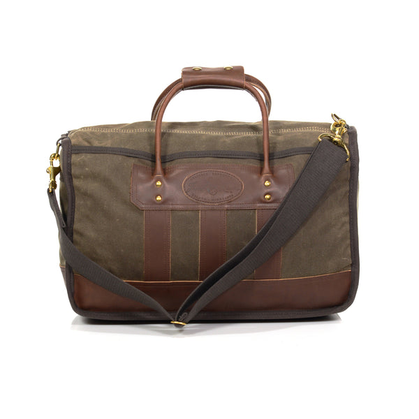 Waxed canvas luggage bag, with a removable cotton webbed shoulder strap. 
