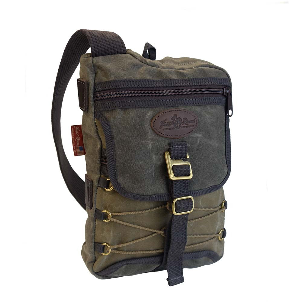 Sling pack with a heavy duty shoulder strap made to fit crossbody with large front zipper pocket.