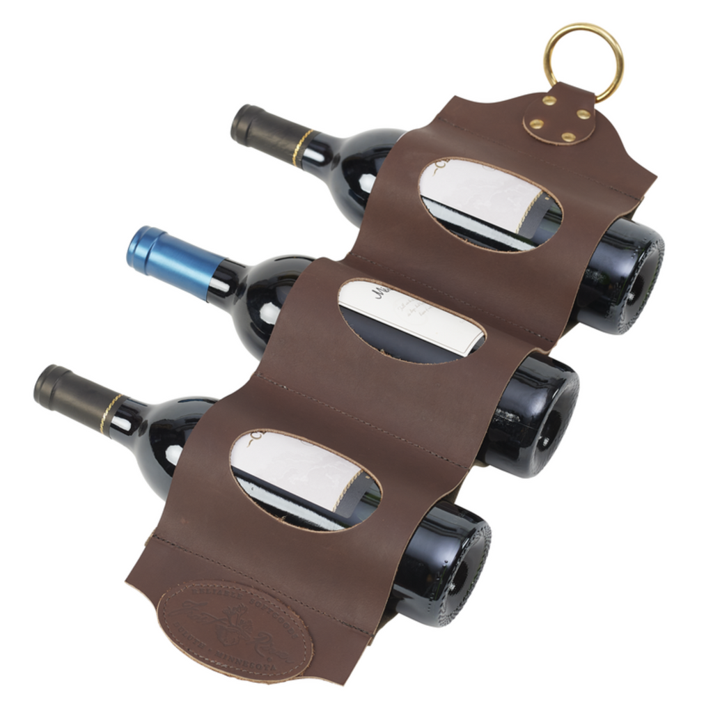 Handcrafted wine bottle holder made from premium leather, durable waxed canvas, and solid brass.
