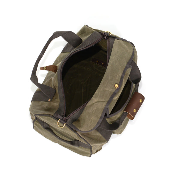 Premium waxed canvas duffle bag with a large zippered opening.