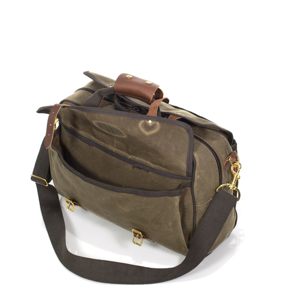 This large brief bag has exterior pockets on each side that are as long as the entire bag both with flap closures and leather straps and solid brass buckles.