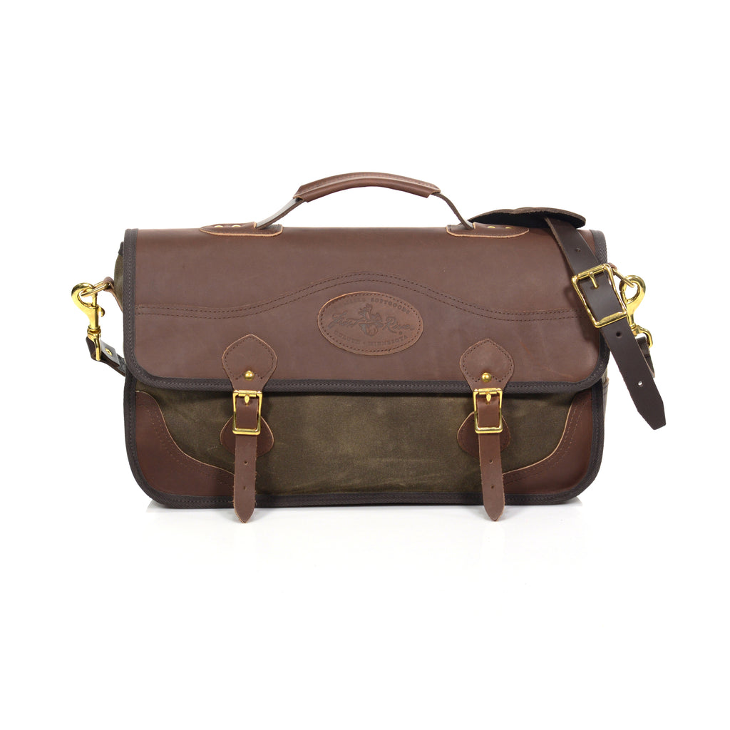 Classic brief bag with a premium leather flap closure with a leather strap and solid brass buckle .