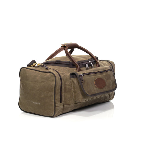 Waxed canvas luggage bag with large exterior pockets.