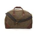 Waxed canvas luggage bag with exterior pockets.