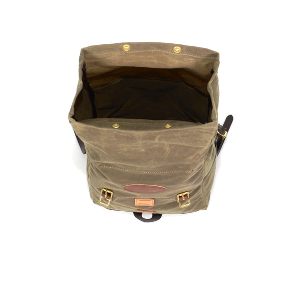 View of the top of pack with open rolldown lid showing the large main compartment.  Brass snaps located at the end of the closure for an even more secure closure. 