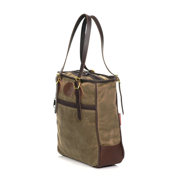 Large tote bag made with premium leather, durable waxed canvas, and solid brass.