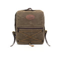 The Itinerant Daypack made out of our forrest green waxed canvas has a small zippered pocket in the front. On front of that pocket is same colored cord  in a hourglass shape for additional storage.