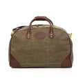 Luggage bag made with durable waxed canvas and premium leather.