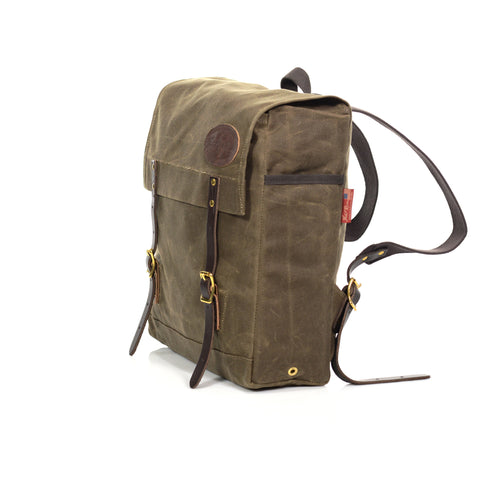 Handcrafted medium day pack with a flap closure and two premium leather straps and brass buckles for the closure.