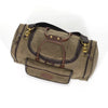 Duffle bag with zippered opening, and a removable cotton web shoulder strap.