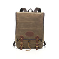 Waxed canvas backpack made with durable materials with a secure large flap closure.